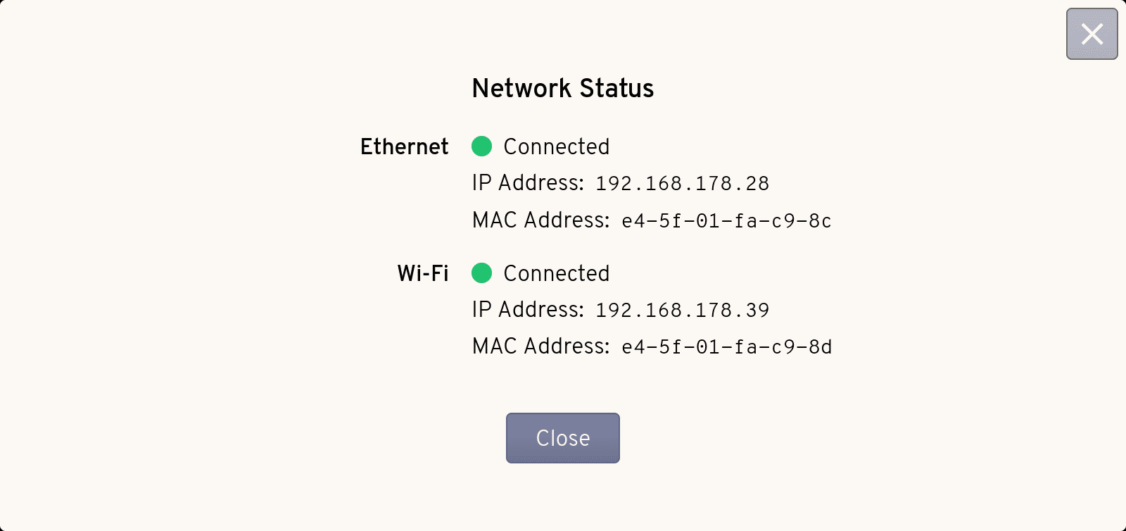 The Network status dialog showing that TinyPilot's Ethernet and Wi-Fi connections are active, along with their IP addresses and MAC addresses.