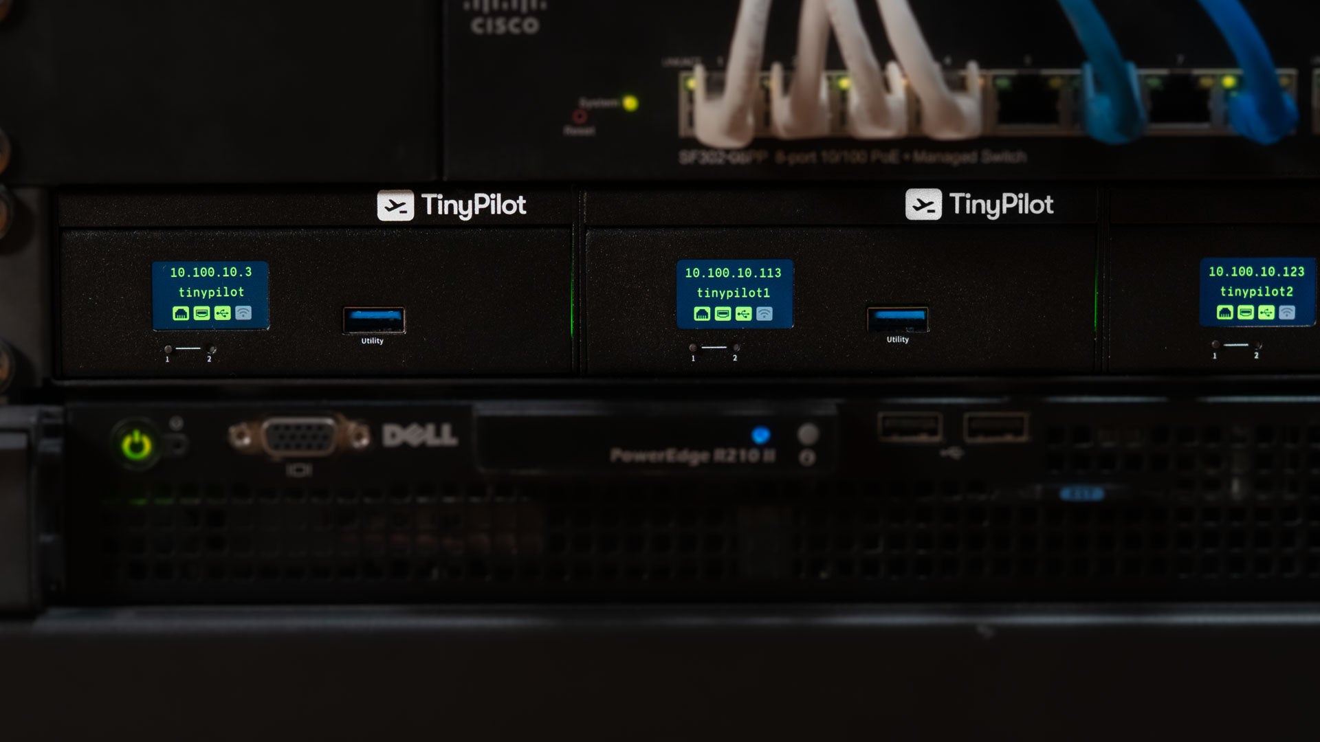 Cisco, TinyPilot, and Dell equipment in a server rack.