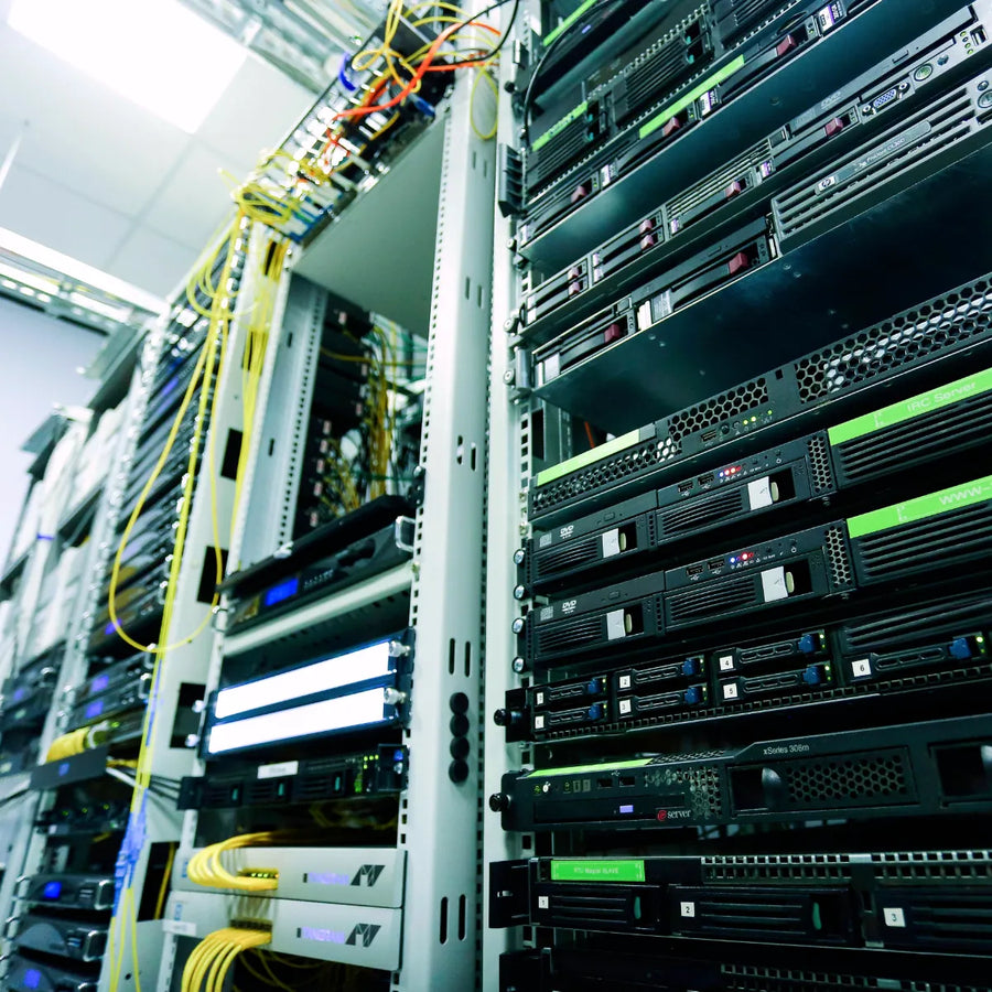 A client's network closet showing servers and switches.